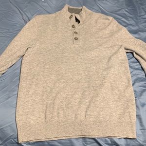 Grey turtleneck, worn a few times, also it has these cool buttons